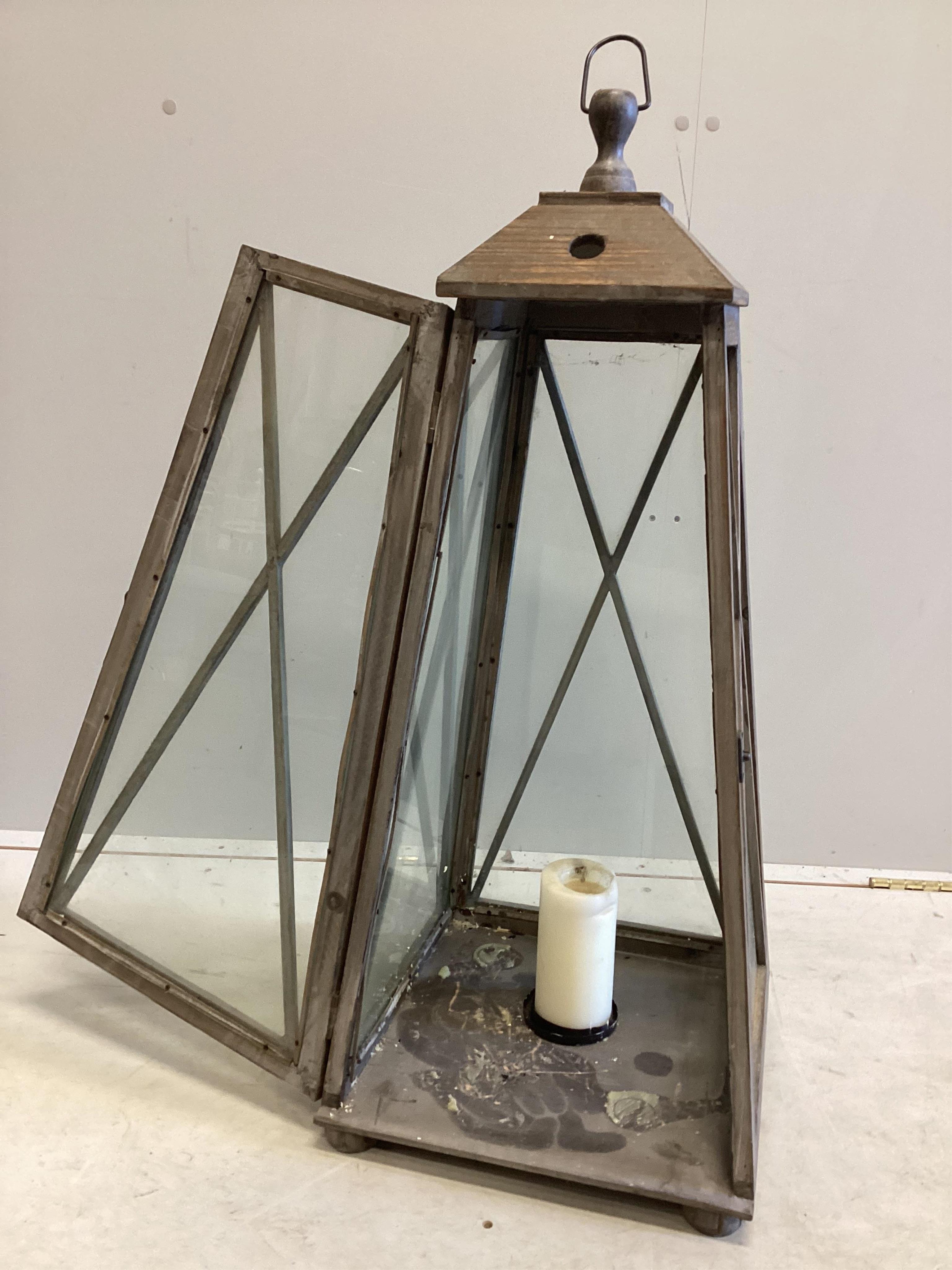 A large contemporary glazed pine interior candle lantern, height 86cm. Condition - good.